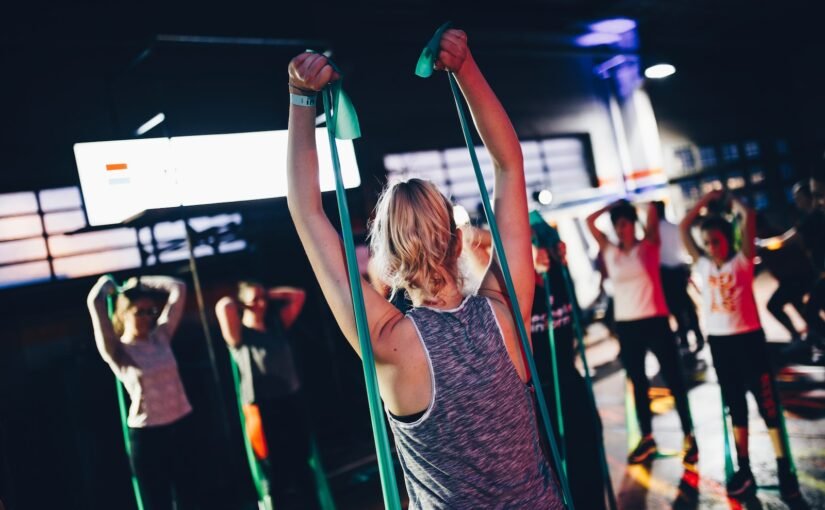 group of people in gym while exercising