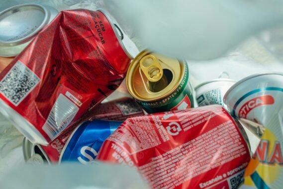 a pile of cans and cans of soda